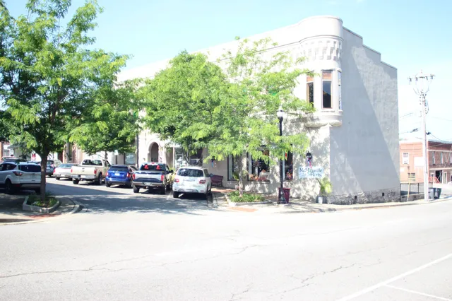 a view of a street with cars