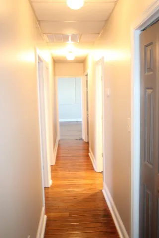 a view of a bathroom from the hallway