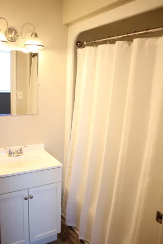 a bathroom with a sink and a mirror