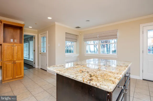 a dining hall with a dining table and chairs