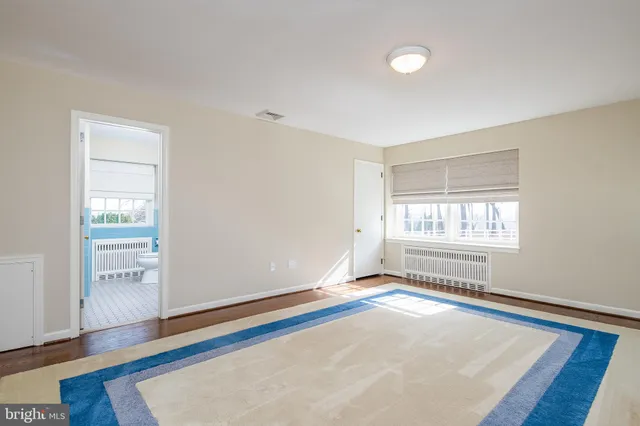 a bathroom with a sink toilet and window
