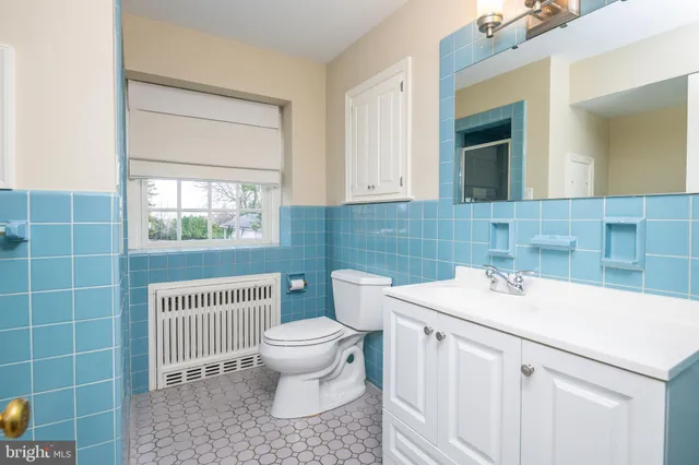 a utility room with cabinets washer and dryer
