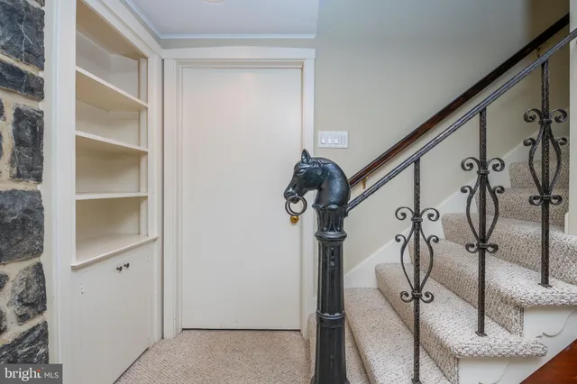 a view of room with window and wooden floor