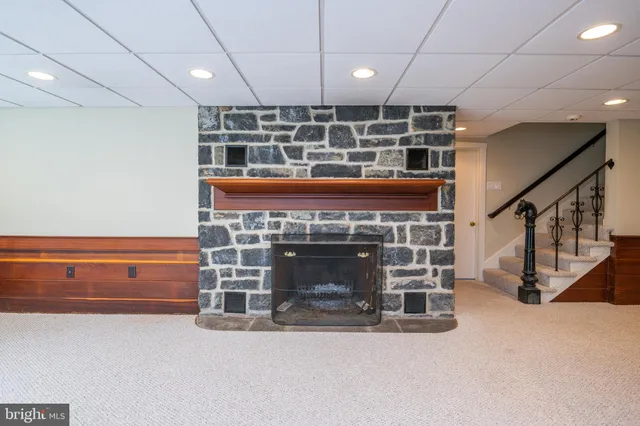 a white toilet sitting next to a bathroom sink