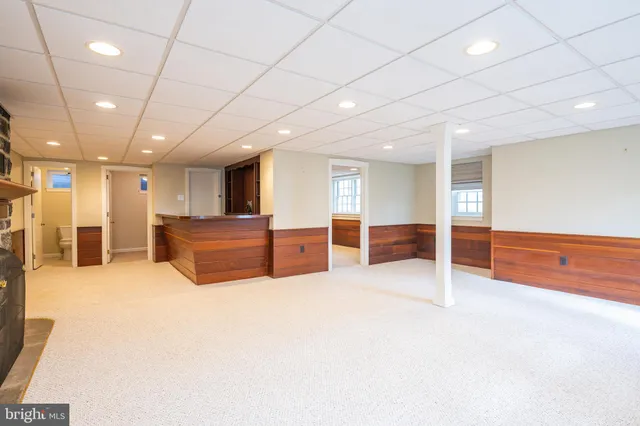 a view of a house with swimming pool and a yard