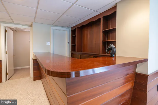 a view of a chair and table in the garden