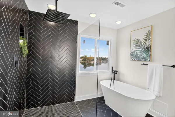 a bathroom with a bathtub and a shower