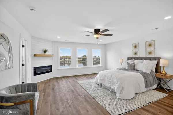 a bedroom with a bed and a couch