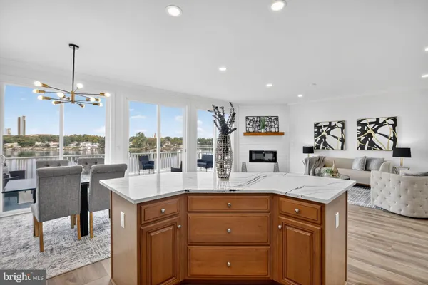 a open kitchen with stainless steel appliances granite countertop a sink stove and refrigerator