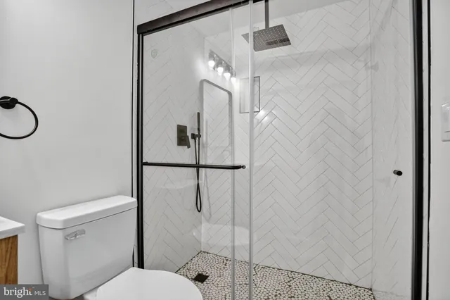 a balcony with wooden floor and outdoor seating