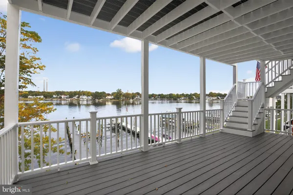 a view of building with outdoor space and lake view