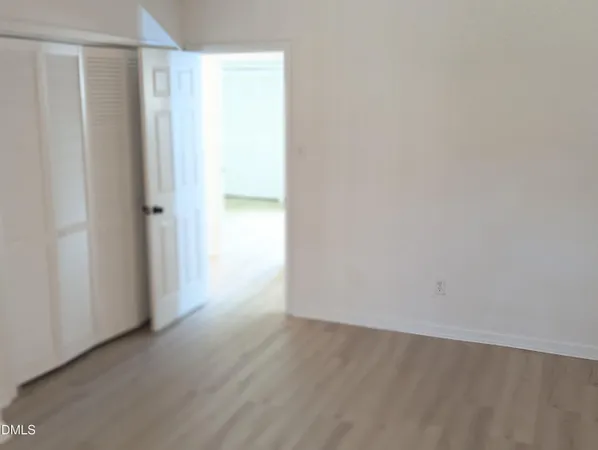 a view of a small space with wooden floor