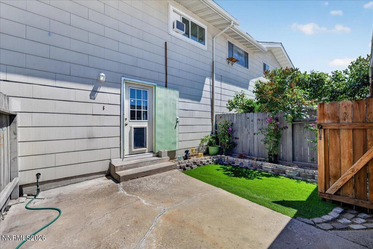 5 Smithridge Park Reno, NV 89502 - Photo 20 of 24 a view of a house with backyard and wooden fence