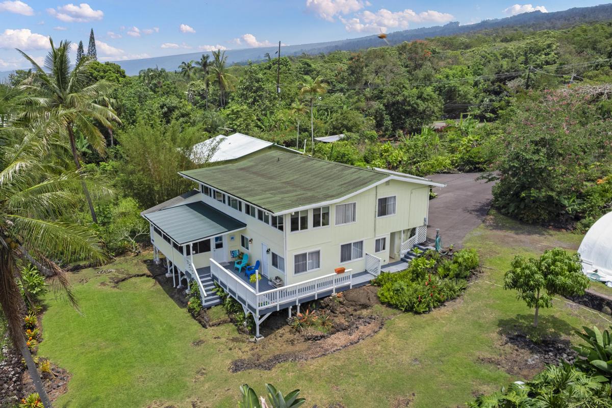 85-4563 Hawaii Belt Road Captain Cook, HI 96704 - Photo 3 of 30 an aerial view of a house with a big yard
