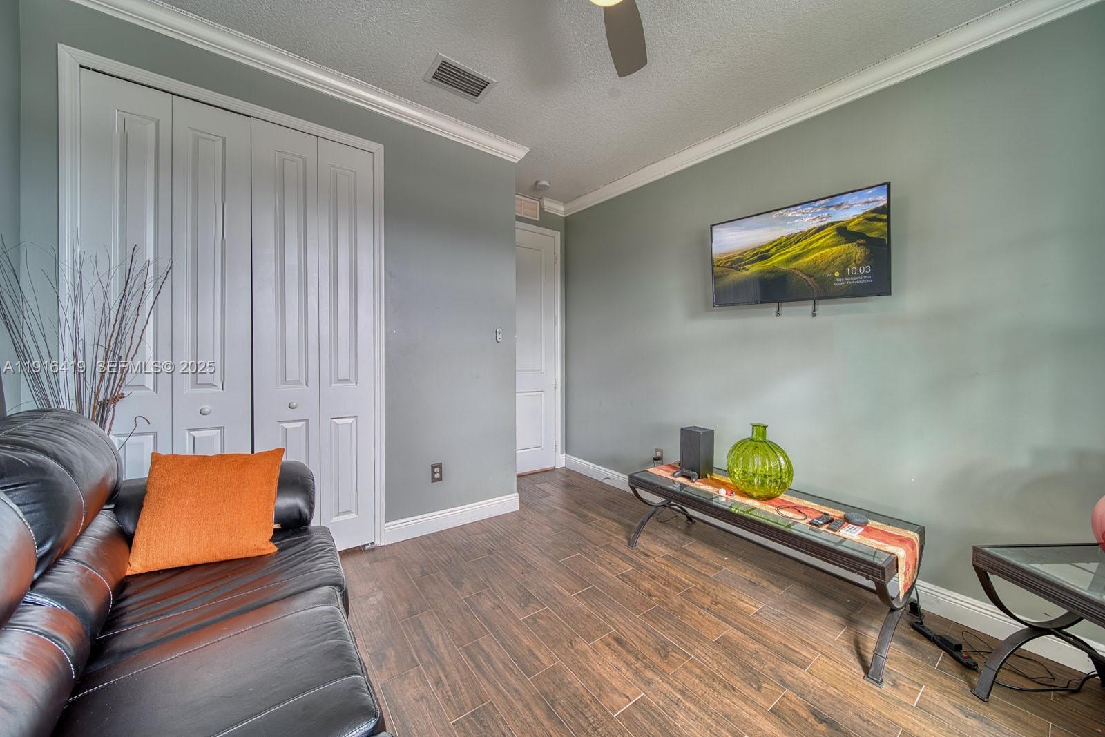 4147 Rosa Drive Deerfield Beach, FL 33064 - Photo 12 of 40 a bed room with a bed and a couch