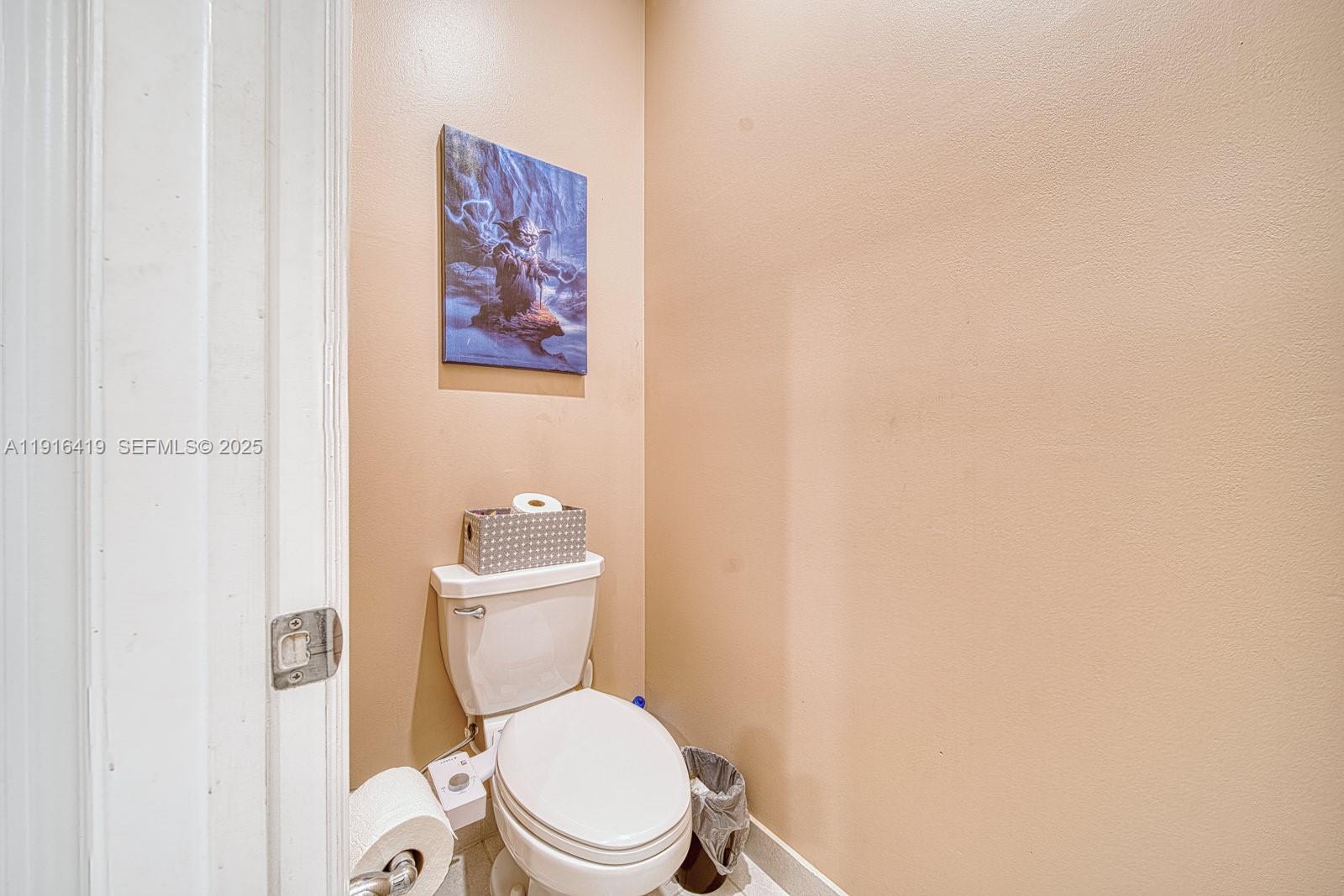 4147 Rosa Drive Deerfield Beach, FL 33064 - Photo 19 of 40 a white toilet sitting next to a white wall