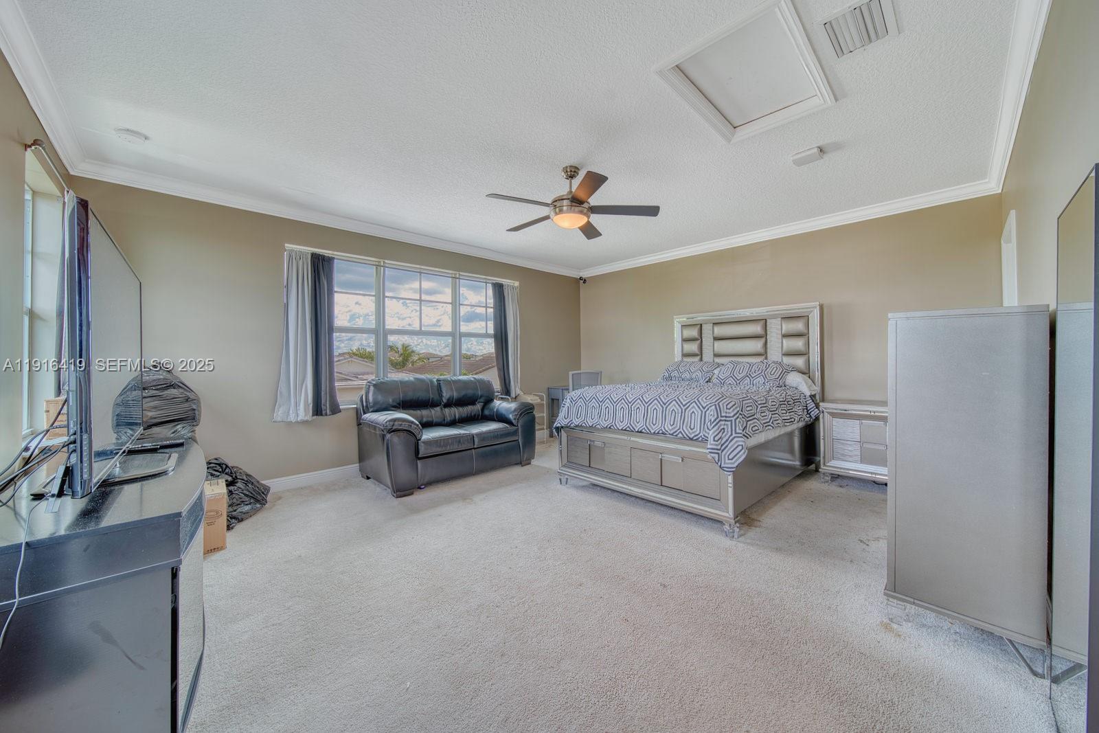 4147 Rosa Drive Deerfield Beach, FL 33064 - Photo 23 of 40 a living room with furniture and a large window
