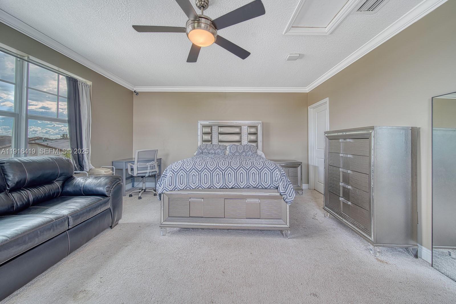 4147 Rosa Drive Deerfield Beach, FL 33064 - Photo 24 of 40 a living room with furniture and a large window