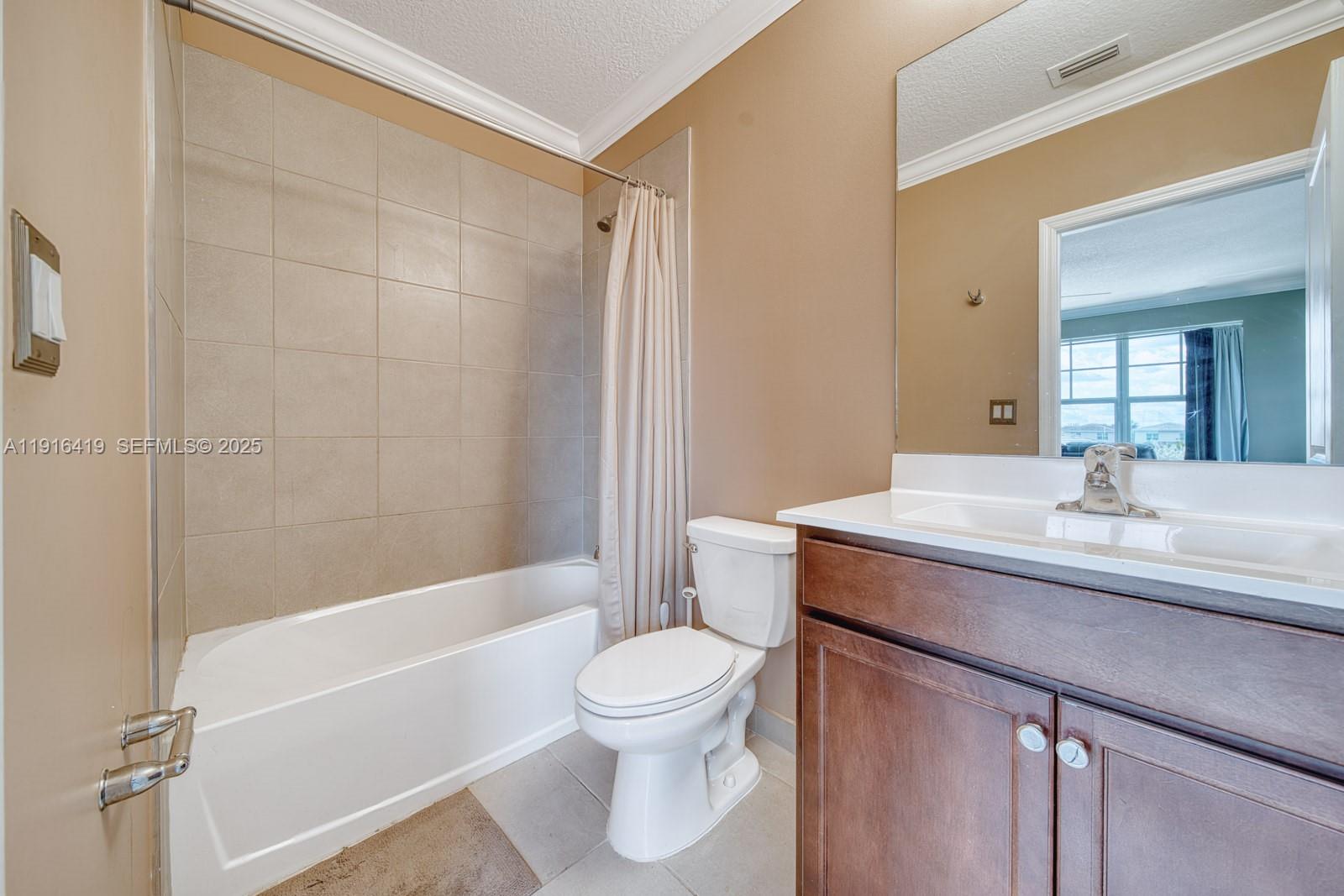 4147 Rosa Drive Deerfield Beach, FL 33064 - Photo 27 of 40 a bathroom with a sink a toilet and a bathtub