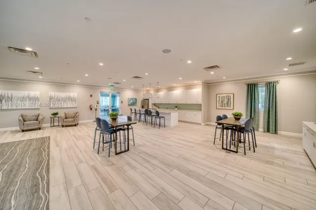 a view of a kitchen and dining room