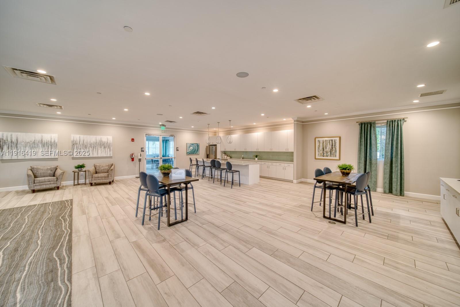 4147 Rosa Drive Deerfield Beach, FL 33064 - Photo 34 of 40 a view of a kitchen and dining room