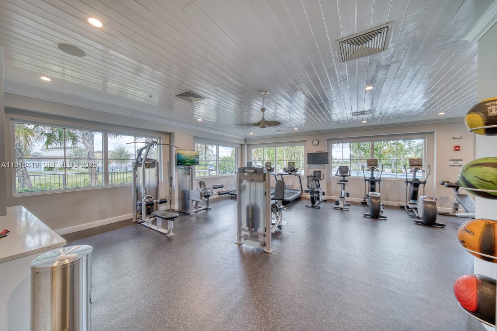 4147 Rosa Drive Deerfield Beach, FL 33064 - Photo 37 of 40 a view of a room with gym equipment