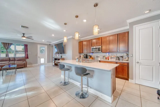 a kitchen with stainless steel appliances granite countertop a sink and cabinets