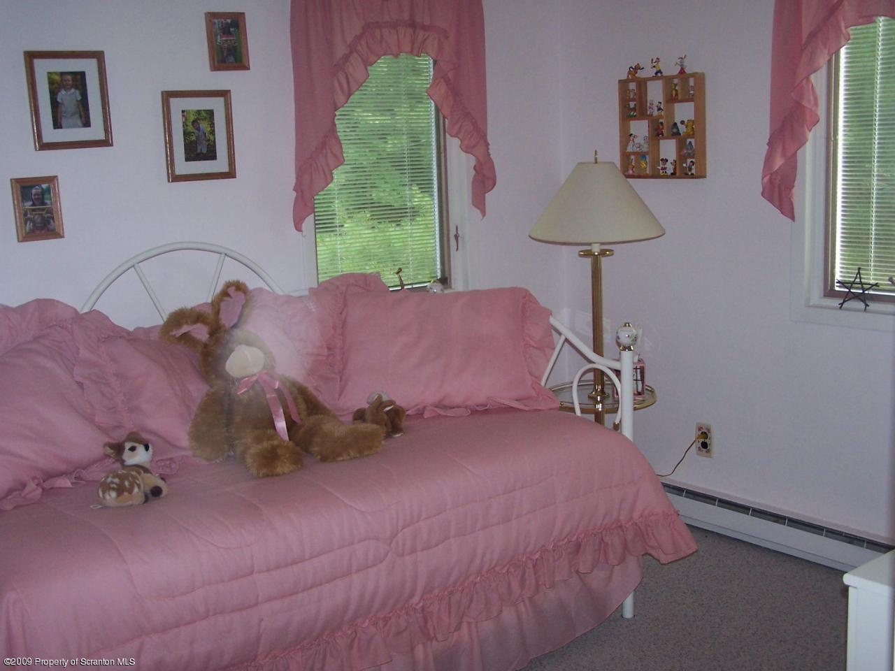 2644 Boulder Road Lake Ariel, PA 18436 - Photo 6 of 15 a bedroom with a bed and a lamp
