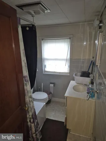 a view of a bathroom from a hallway