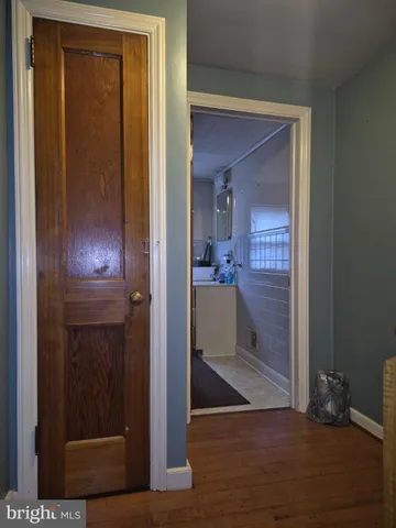 a living room with furniture and a projector screen