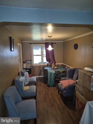 a living room with furniture and a projector screen