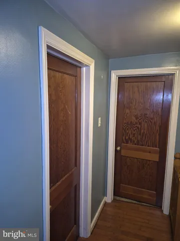 a living room with furniture a air conditioner vent and a window
