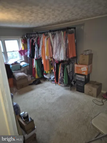 a living room with furniture and a mirror