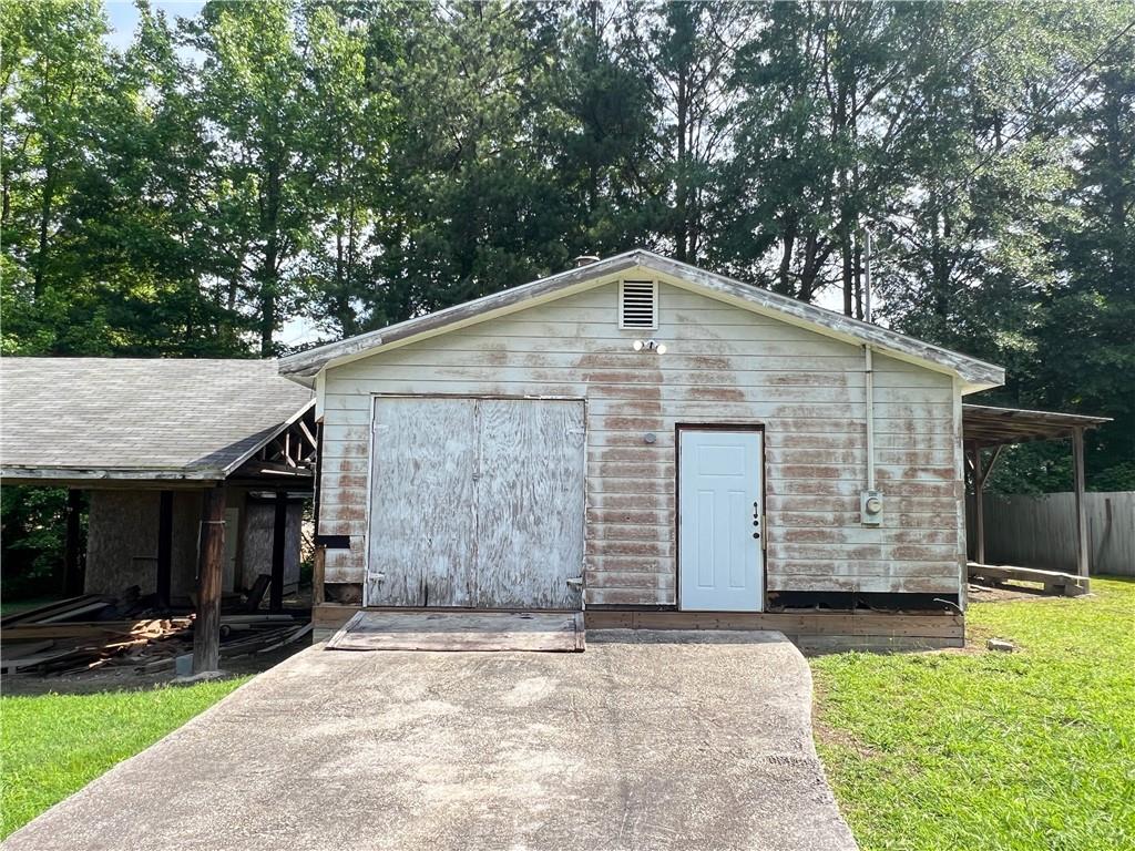 340 Womack Avenue Dallas, GA 30157 - Photo 3 of 29 a front view of house with a garden