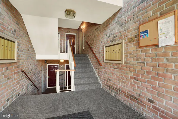 a view of a hall with stairs