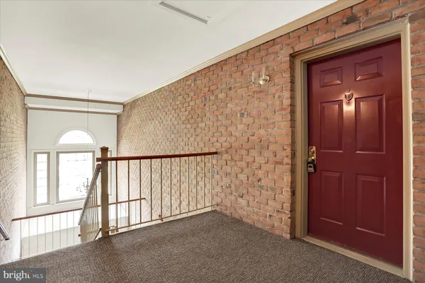 wooden floor and brick walls