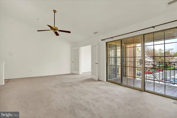 a view of empty room with windows