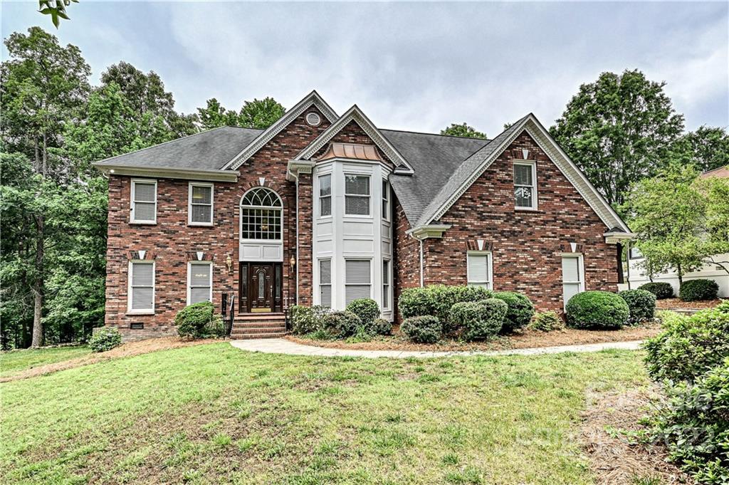 9528 Millen Drive Harrisburg, NC 28075 - Photo 1 of 48 a front view of a house with a yard