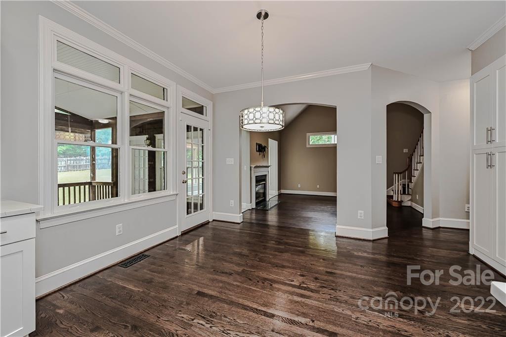 9528 Millen Drive Harrisburg, NC 28075 - Photo 18 of 48 an empty room with wooden floor and a rug