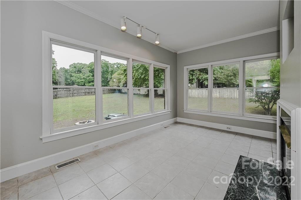 9528 Millen Drive Harrisburg, NC 28075 - Photo 22 of 48 an empty room with large windows