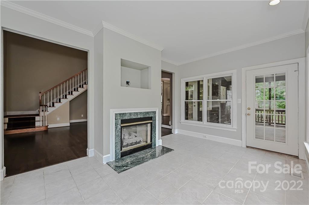 9528 Millen Drive Harrisburg, NC 28075 - Photo 24 of 48 a living room with furniture and a fireplace