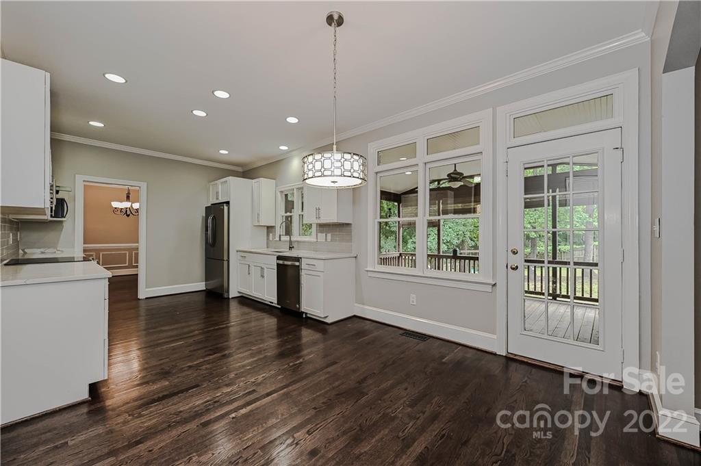 9528 Millen Drive Harrisburg, NC 28075 - Photo 27 of 48 a view of a kitchen with furniture and wooden floor