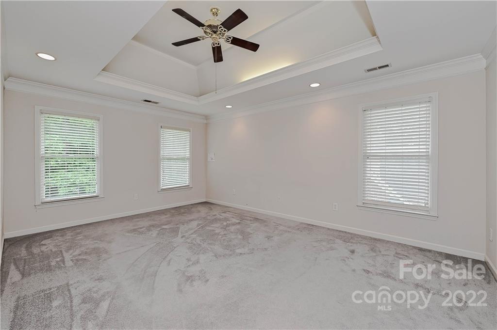 9528 Millen Drive Harrisburg, NC 28075 - Photo 31 of 48 a view of empty room with window and ceiling fan