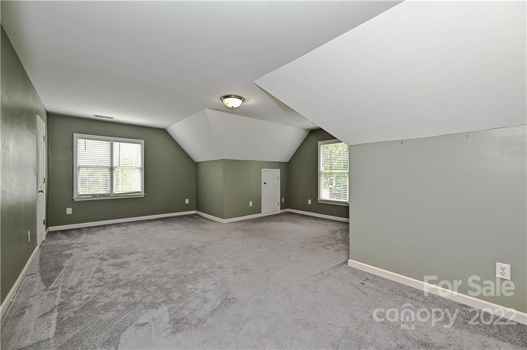 9528 Millen Drive Harrisburg, NC 28075 - Photo 39 of 48 an empty room with windows and closet