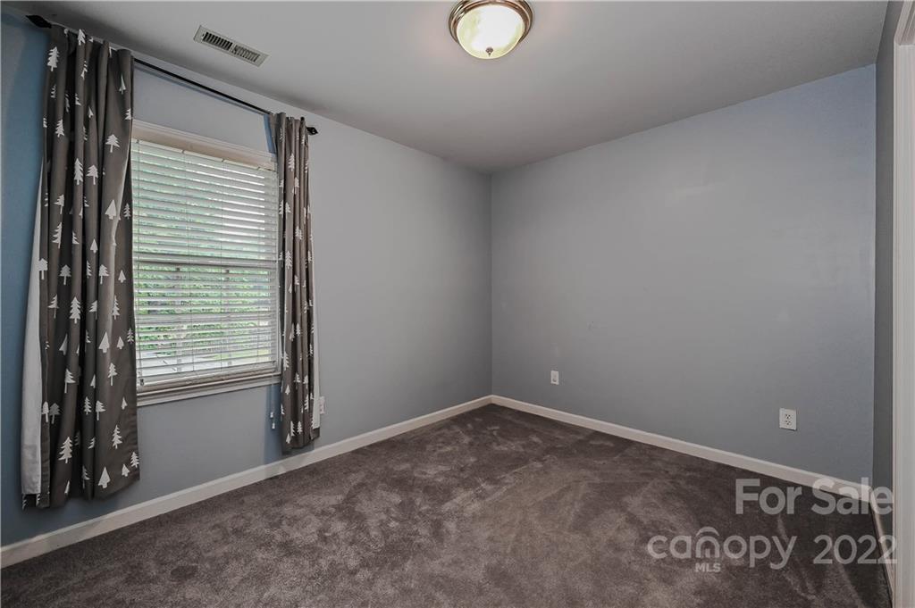 9528 Millen Drive Harrisburg, NC 28075 - Photo 41 of 48 a view of an empty room with a window