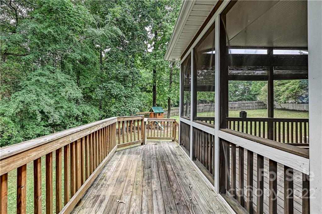 9528 Millen Drive Harrisburg, NC 28075 - Photo 44 of 48 a view of balcony with deck and wooden floor