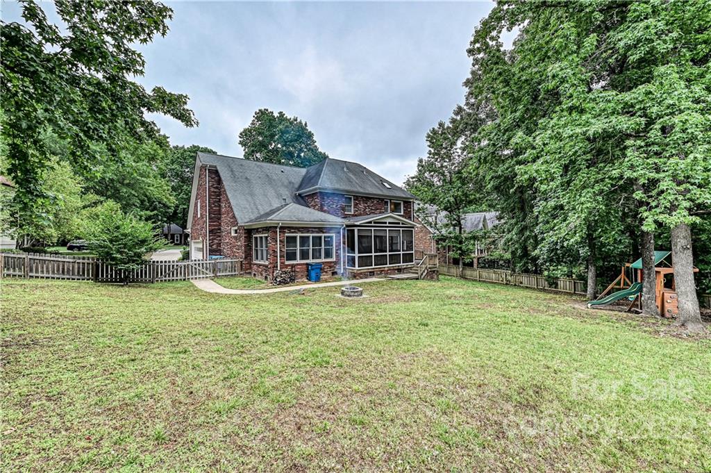 9528 Millen Drive Harrisburg, NC 28075 - Photo 47 of 48 a view of a house with a yard balcony and sitting area