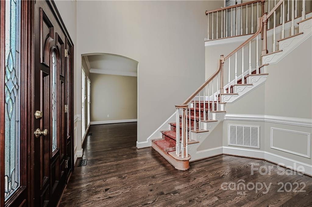 9528 Millen Drive Harrisburg, NC 28075 - Photo 9 of 48 a view of entryway with wooden floor