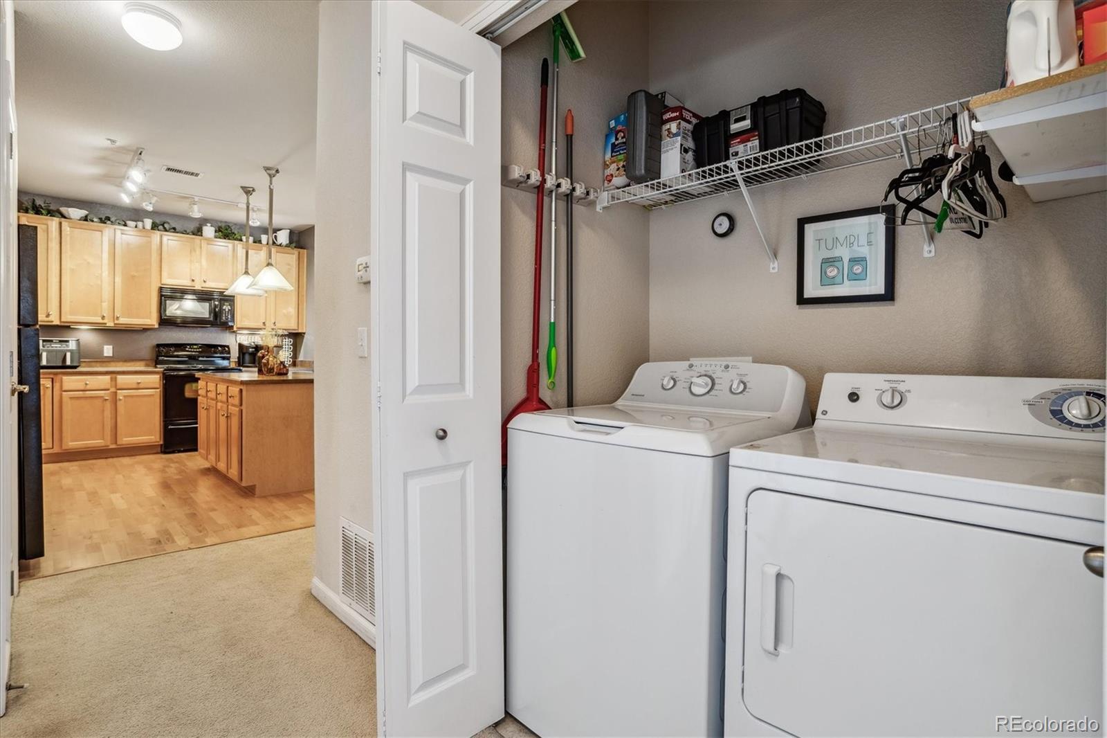 9370 Las Ramblas Court, Unit R Parker, CO 80134 - Photo 18 of 39 a view of storage and utility room with washer and dryer