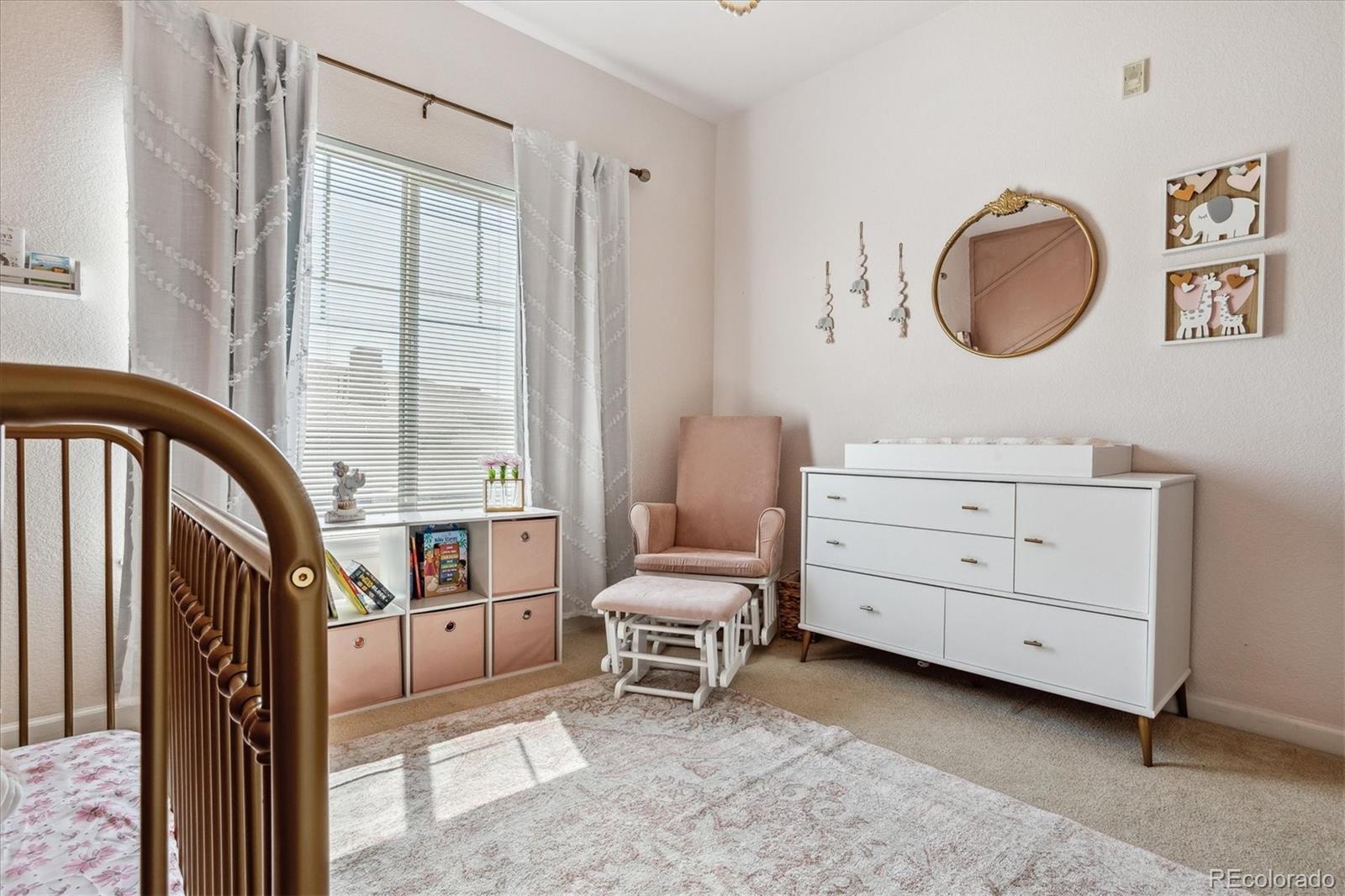 9370 Las Ramblas Court, Unit R Parker, CO 80134 - Photo 21 of 39 a living room with furniture and a window